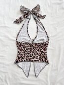 Camisola Negro Elegante con Hebilla Metálica y Dobladillo Asimétrico